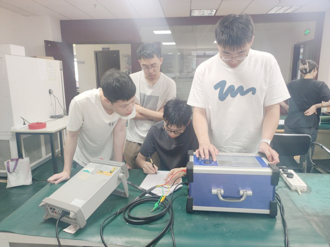 HUST interns practicing PCB soldering at Haomai's manufacturing facility